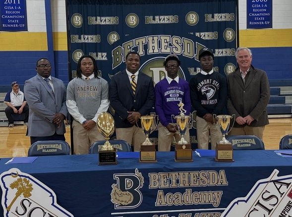 Bethesda Signing Day: (From L-R) Coach Antwain Turner, Jordan Cheever, Isaiah Redmond, Malachi Morris, Ralo Wesley and Bethesda School President Chris Proctor.