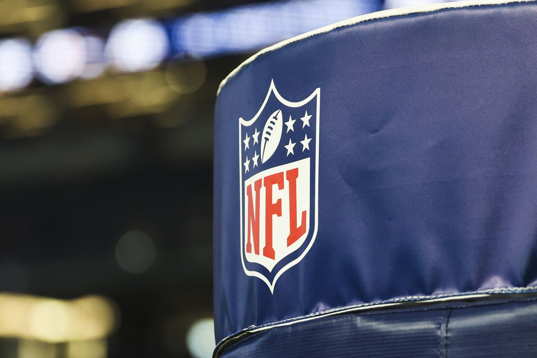 Detail of NFL logo on a goal post pad before a game between the Los Angeles Chargers and Dallas Cowboys at AT&T Stadium.