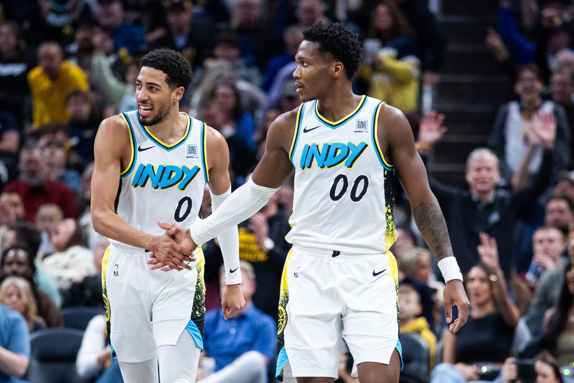 Indiana Pacers guard Bennedict Mathurin (00) celebrates a made shot with  guard Tyrese Haliburton (0)  in the second half against the Milwaukee Bucks at Gainbridge Fieldhouse.