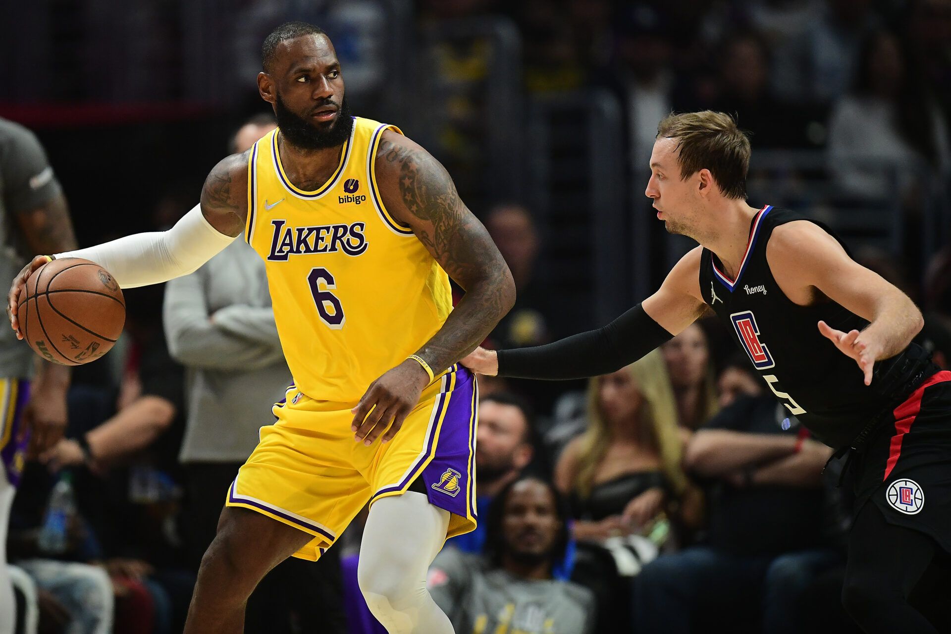 Los Angeles Lakers forward LeBron James (6) moves the ball against Los Angeles Clippers guard Luke Kennard (5) during the first half at Crypto.com Arena.