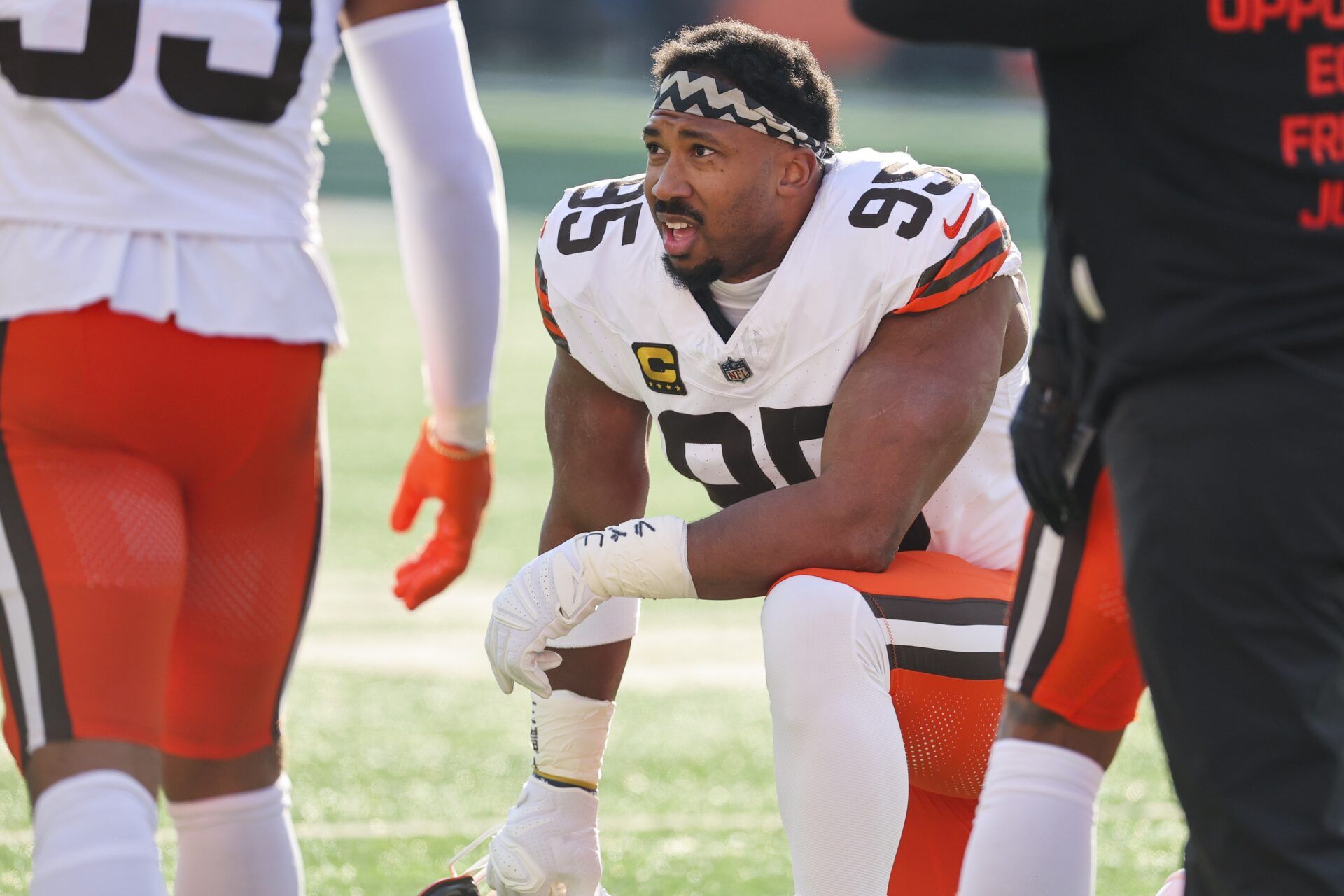 Cleveland Browns defensive end Myles Garrett (95) kneels on the field during a first half timeout against the Cincinnati Bengals at Paycor Stadium.