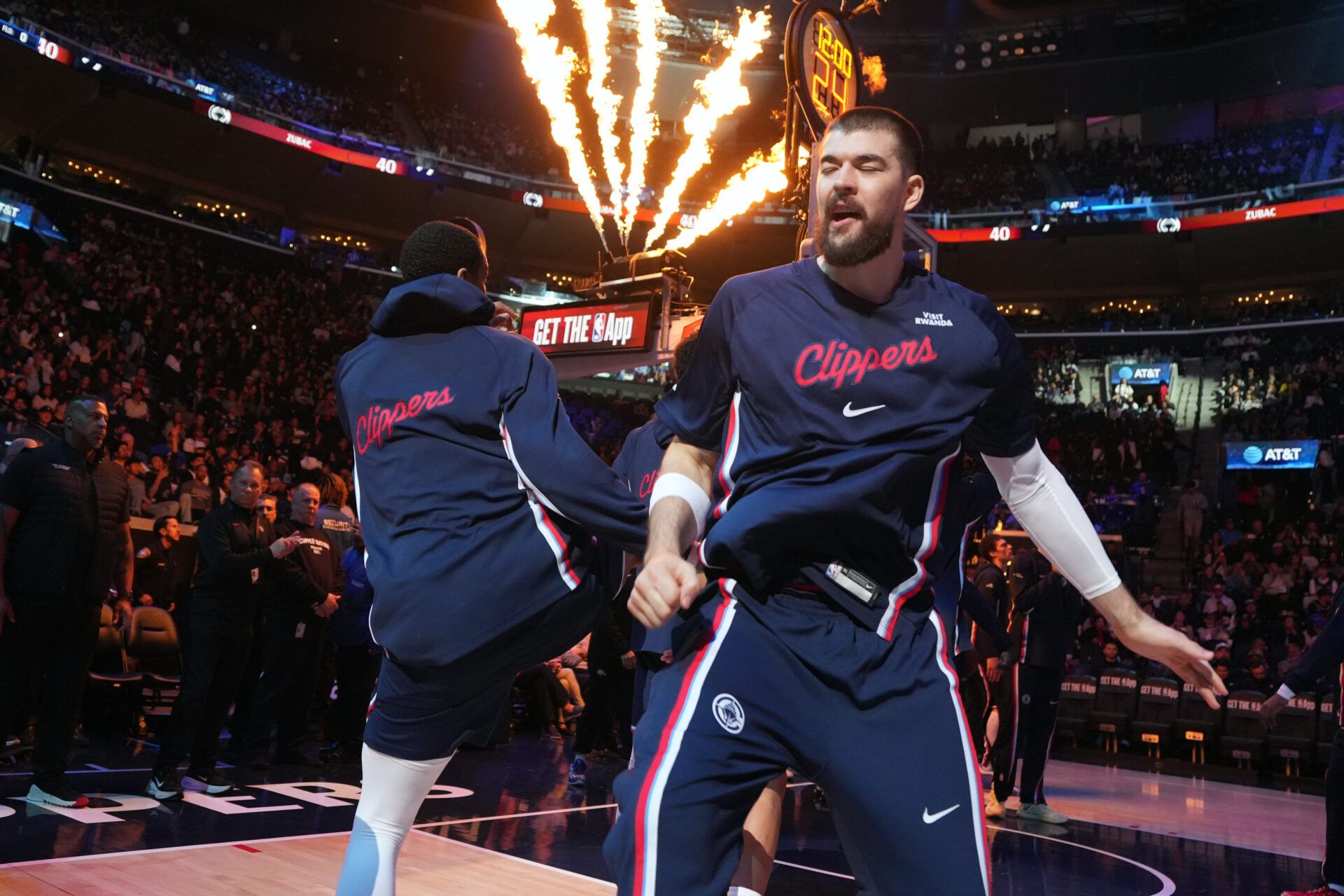 LA Clippers center Ivica Zubac (right) is introduced before the game against the Golden State Warriors at the Intuit Dome.