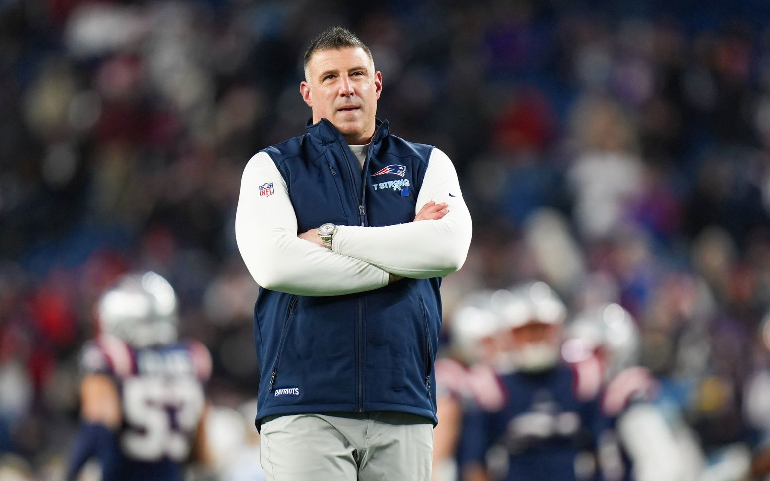 New England Patriots head coach Mike Vrabel looks on before the game against the Los Angeles Chargers in an AFC Wild Card Round game at Gillette Stadium.