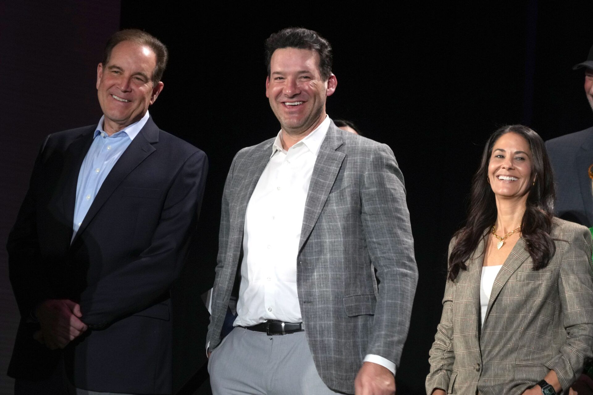 CBS Sports play-by-play announcer Jim Nantz (left), analyst Tony Romo (center) and sideline reporter Tracy Wolfson at press conference at the Super Bowl 58 Media Center at the Mandalay Bay Resort and Casino.