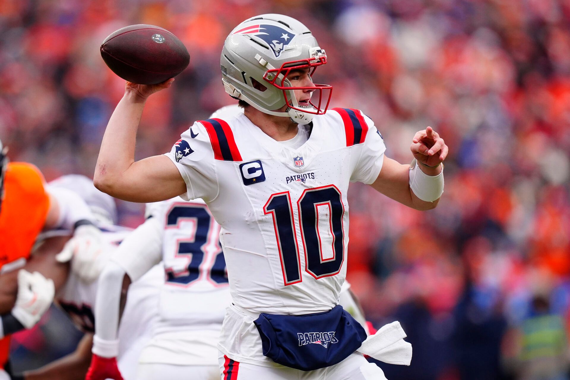 New England Patriots quarterback Drake Maye (10) drops back to pass against the Denver Broncos during the first half in the 2026 AFC Championship Game at Empower Field at Mile High.