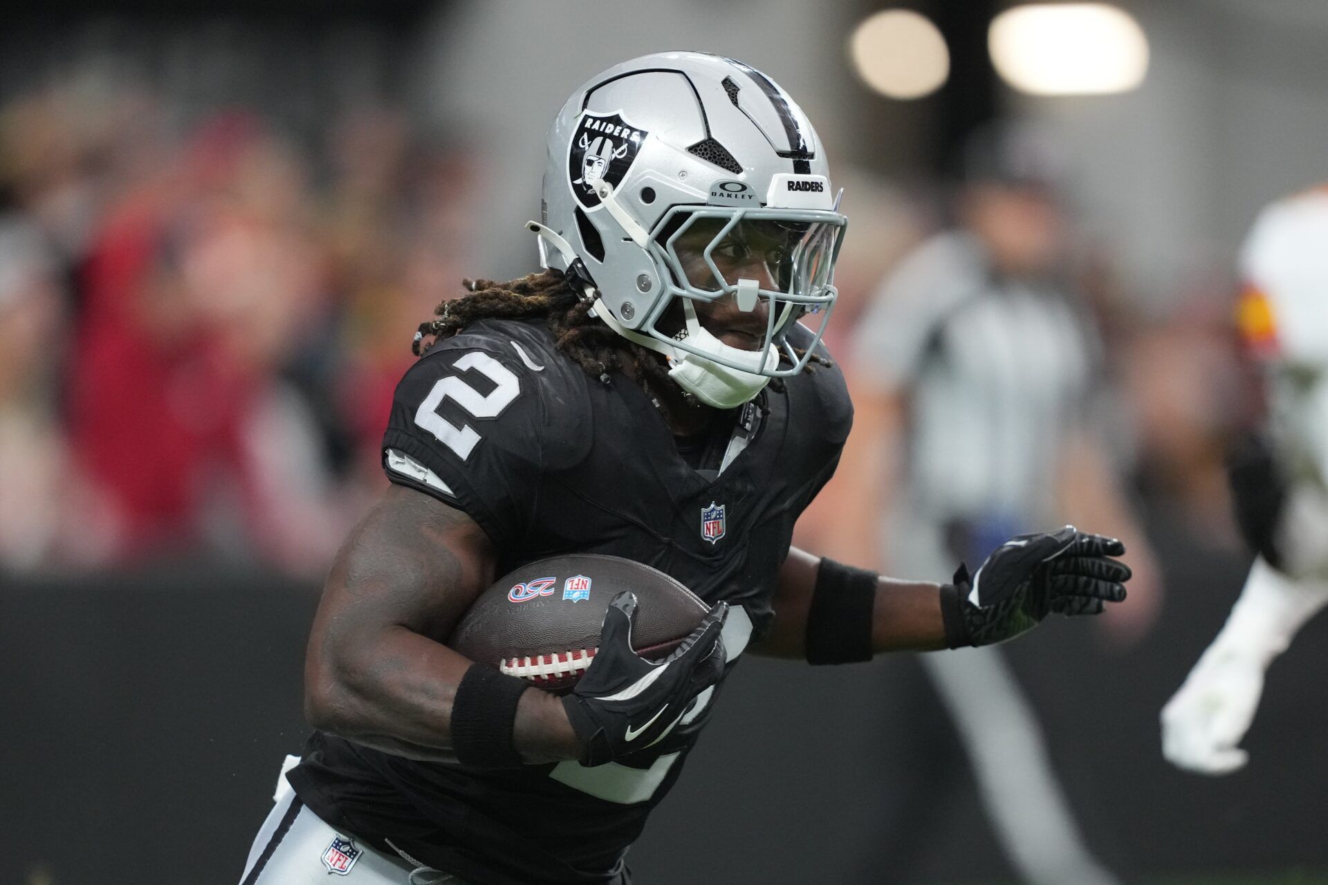 Las Vegas Raiders running back Ashton Jeanty (2) carries the ball against the Kansas City Chiefs in the first half at Allegiant Stadium.
