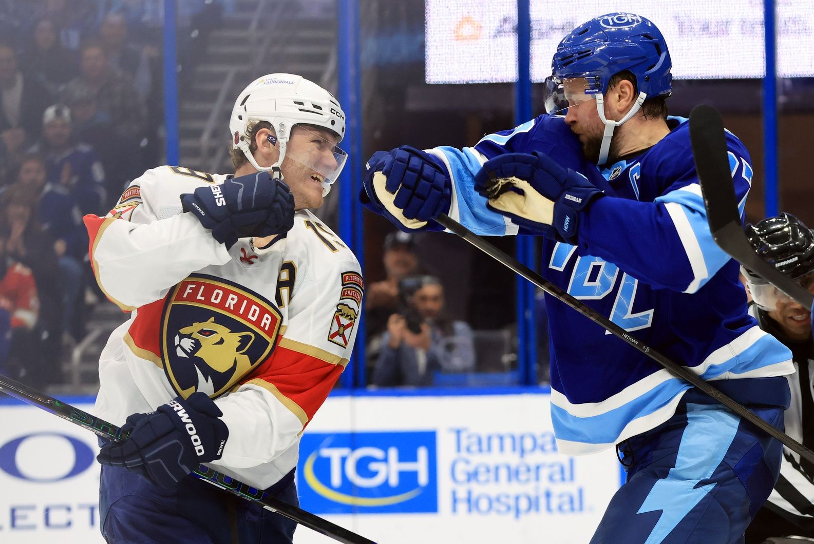 Florida Panthers left wing Matthew Tkachuk (19) and Tampa Bay Lightning defenseman Victor Hedman (77) fight during the second period at Benchmark International Arena.
