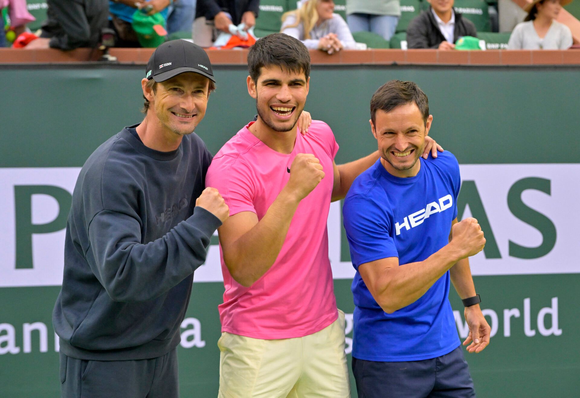 Carlos Alcaraz (ESP) poses with his coaches Juan Carlos Ferrero and Juanjo Moreno after defeating Daniil Medvedev (RUS) in the men’s final of the BNP Paribas Open at the Indian Wells Tennis Garden.