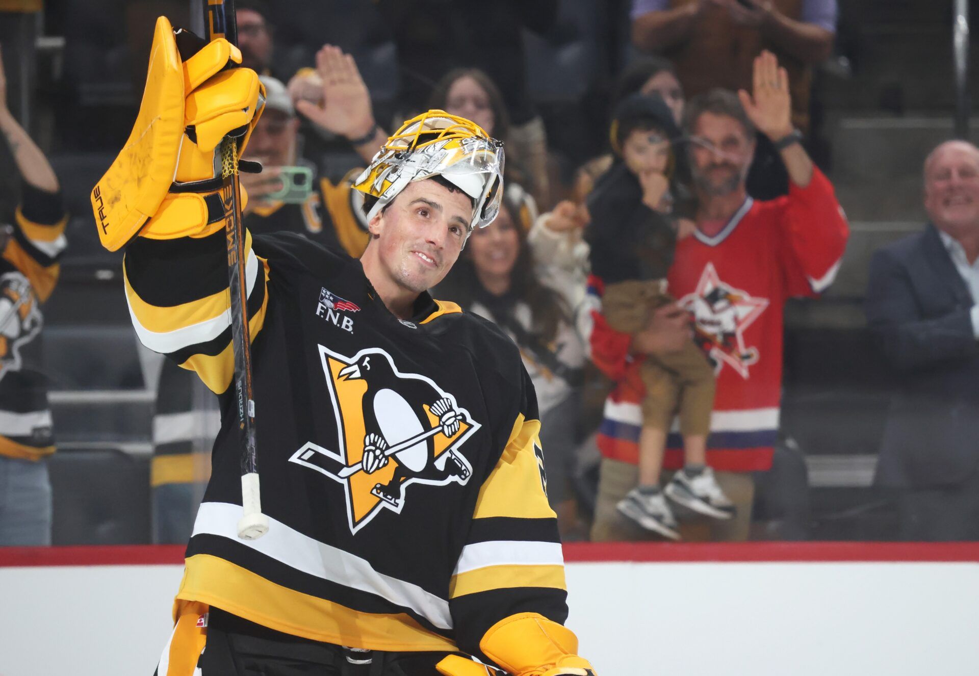 Pittsburgh Penguins goaltender Marc-Andre Fleury (29) acknowledges the crowd after playing in his final NHL game against the Columbus Blue Jackets at PPG Paints Arena.