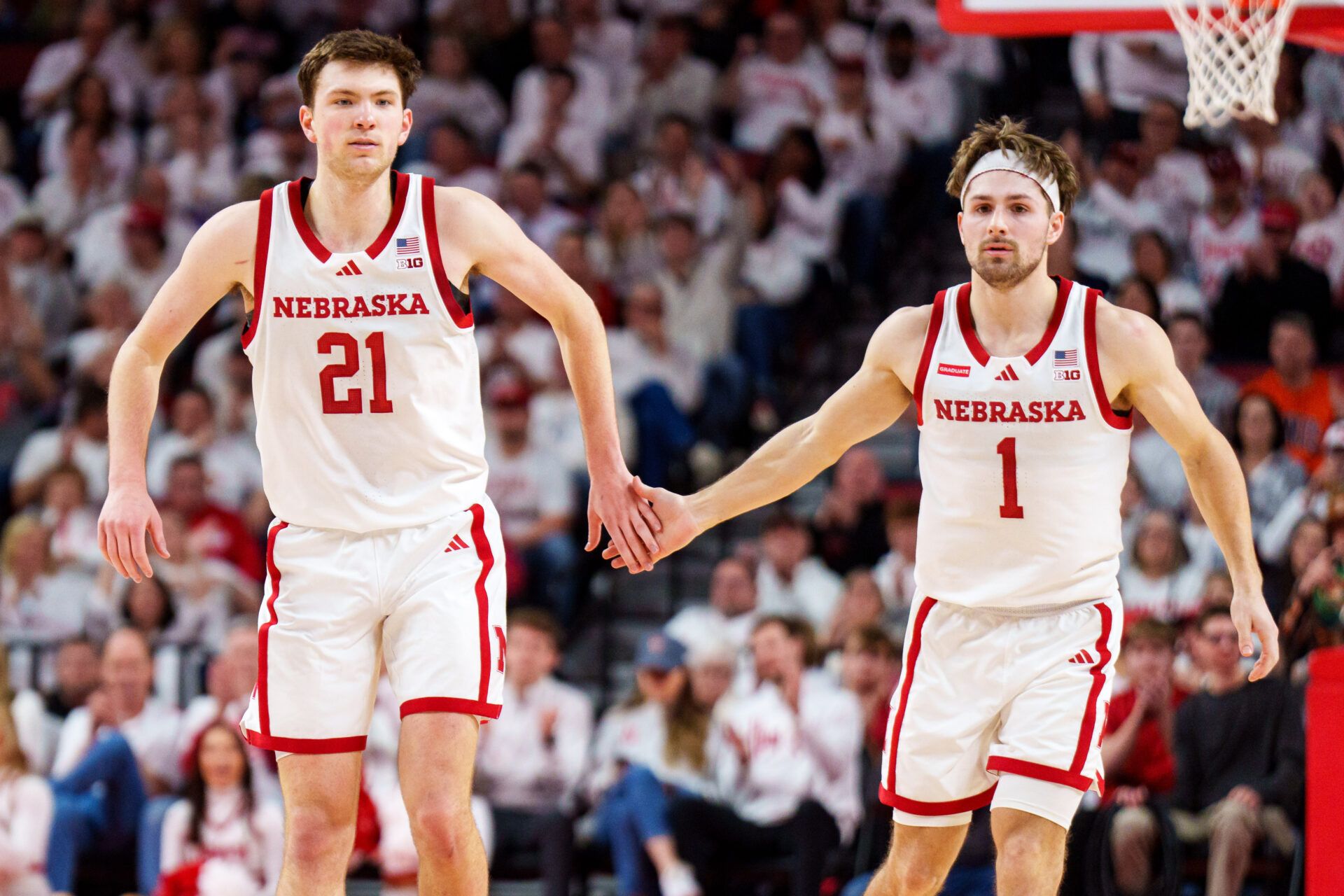 Nebraska Cornhuskers forward Pryce Sandfort (21) and guard Sam Hoiberg (1) celebrate after a three point shot against the Illinois Fighting Illini during the first half at Pinnacle Bank Arena.