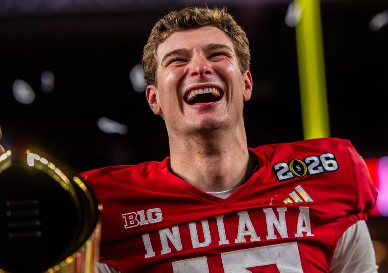 Indiana's Fernando Mendoza (15) smiles on the podium after the College Football Playoff National Championship college football game at Hard Rock Stadium in Miami Gardens on Monday, Jan. 19, 2026.