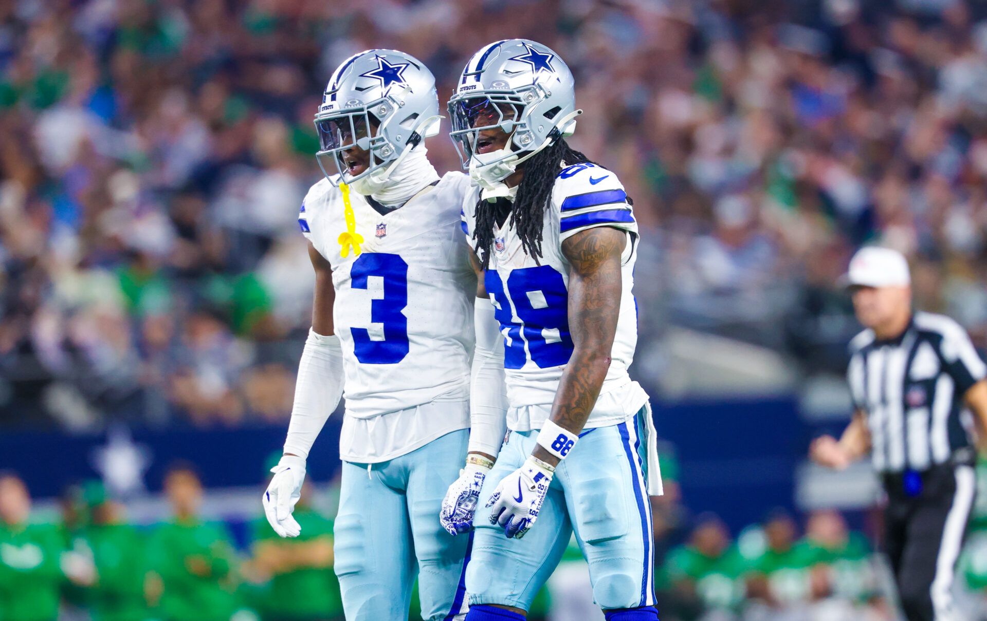 Dallas Cowboys wide receiver George Pickens (3) and Dallas Cowboys wide receiver CeeDee Lamb (88) react during the game against the Philadelphia Eagles at AT&T Stadium.