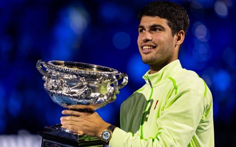 Carlos Alcaraz of Spain with the Norman Brookes Challenge Cup after his victory over Novak Djokovic of Serbia in the final of the mens singles at the Australian Open at Rod Laver Arena in Melbourne Park.