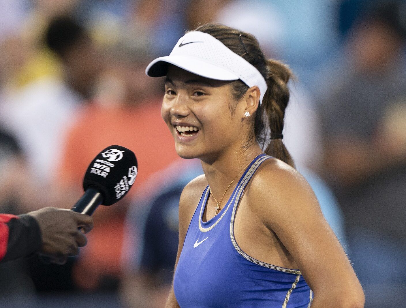 Emma Raducanu (GBR) at her oncourt interview after her match against Serena Williams (USA) at the Western & Southern Open at the at the Lindner Family Tennis Center.