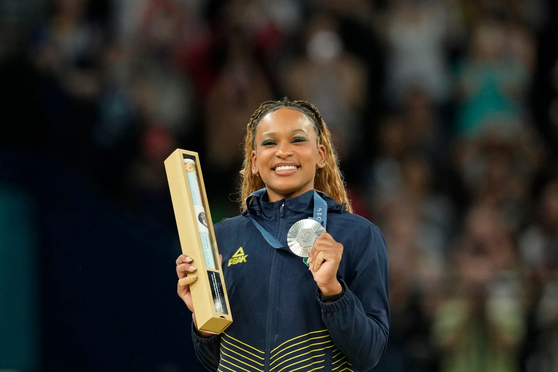 Rebeca Andrade of Brazil celebrates her silver medal on the vault on the first day of gymnastics event finals during the Paris 2024 Olympic Summer Games at Bercy Arena.