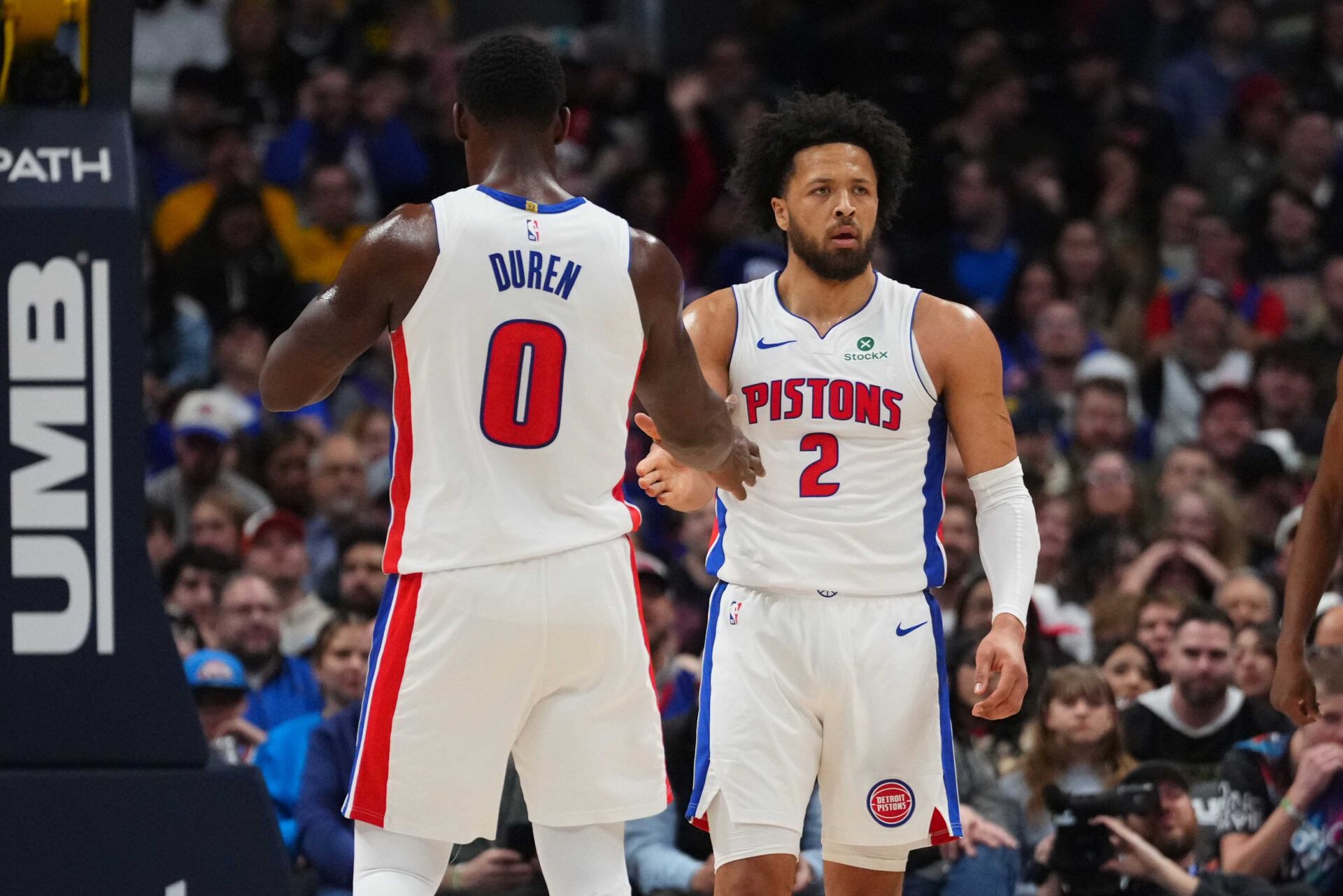 Detroit Pistons guard Cade Cunningham (2) and center Jalen Duren (0) react to a foul called in the first quarter against the Denver Nuggets at Ball Arena.