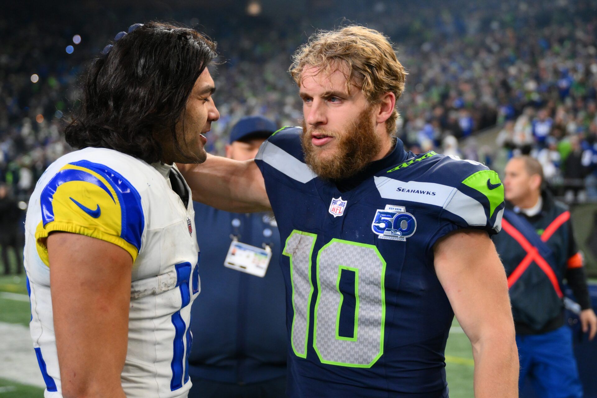 Seattle Seahawks wide receiver Cooper Kupp (10) and Los Angeles Rams wide receiver Puka Nacua (12) talk after the 2026 NFC Championship Game at Lumen Field.