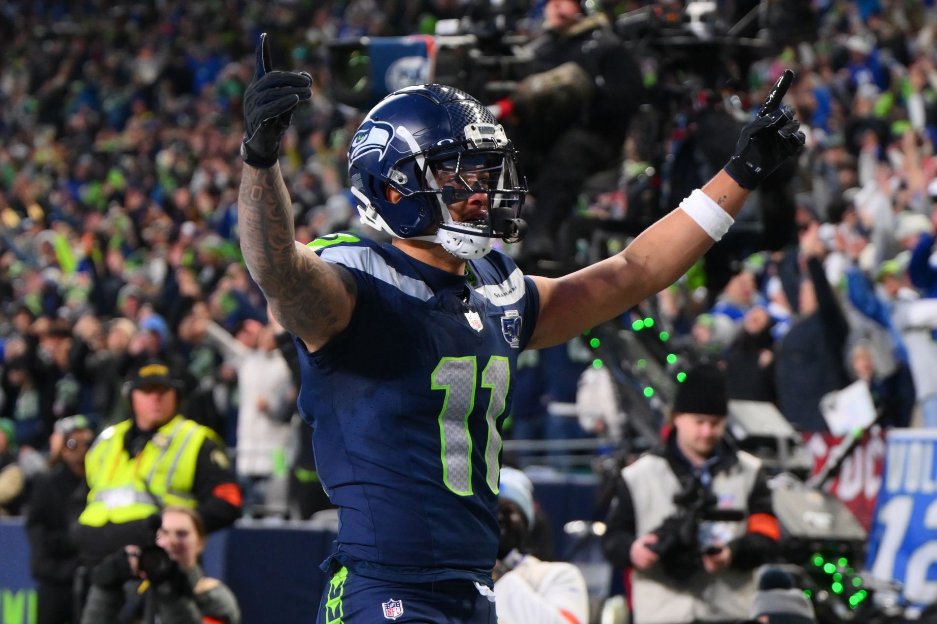 Seattle Seahawks wide receiver Jaxon Smith-Njigba (11) celebrates after scoring a touchdown against the Los Angeles Rams during the first half in the 2026 NFC Championship Game at Lumen Field.