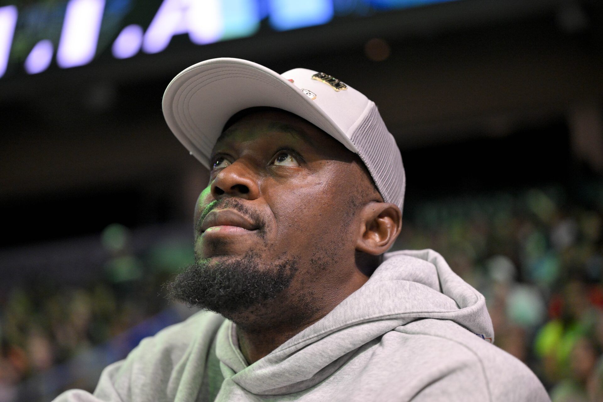 Olympic champion sprinter Usain Bolt looks on during the second half of the game between the Dallas Wings and the New York Liberty at College Park Center.