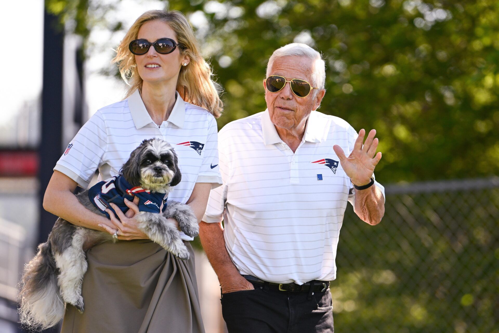 New England Patriots owner Robert Kraft and his wife Dr. Dana Blumberg bring their dog Heisman to training camp at Gillette Stadium.