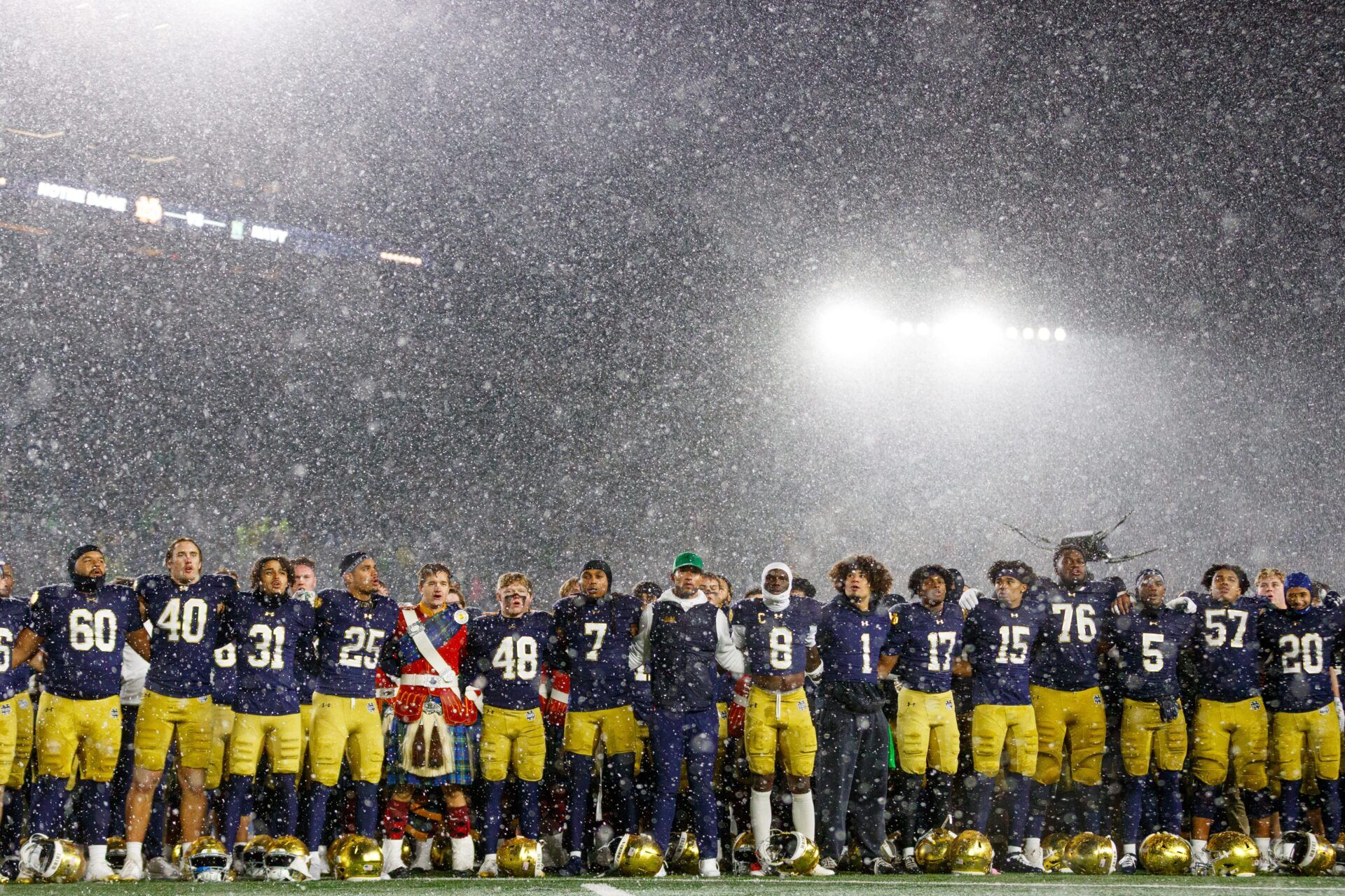 Notre Dame head coach Marcus Freeman, center, celebrates with his players after winning a NCAA football game 49-10 against Navy at Notre Dame Stadium on Saturday, Nov. 8, 2025, in South Bend.