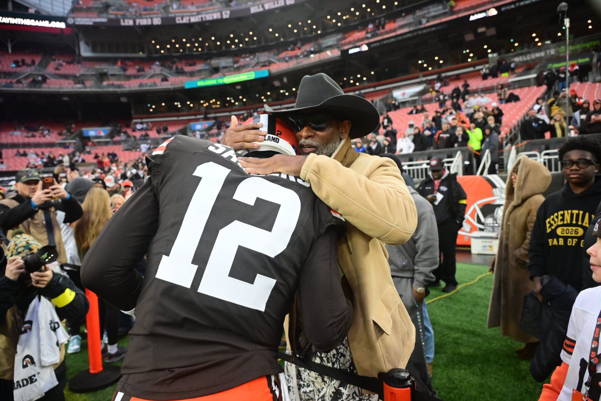 Cleveland Browns quarterback Shedeur Sanders (12) and his father Deion Sanders before the game against the Pittsburgh Steelers at Huntington Bank Field.