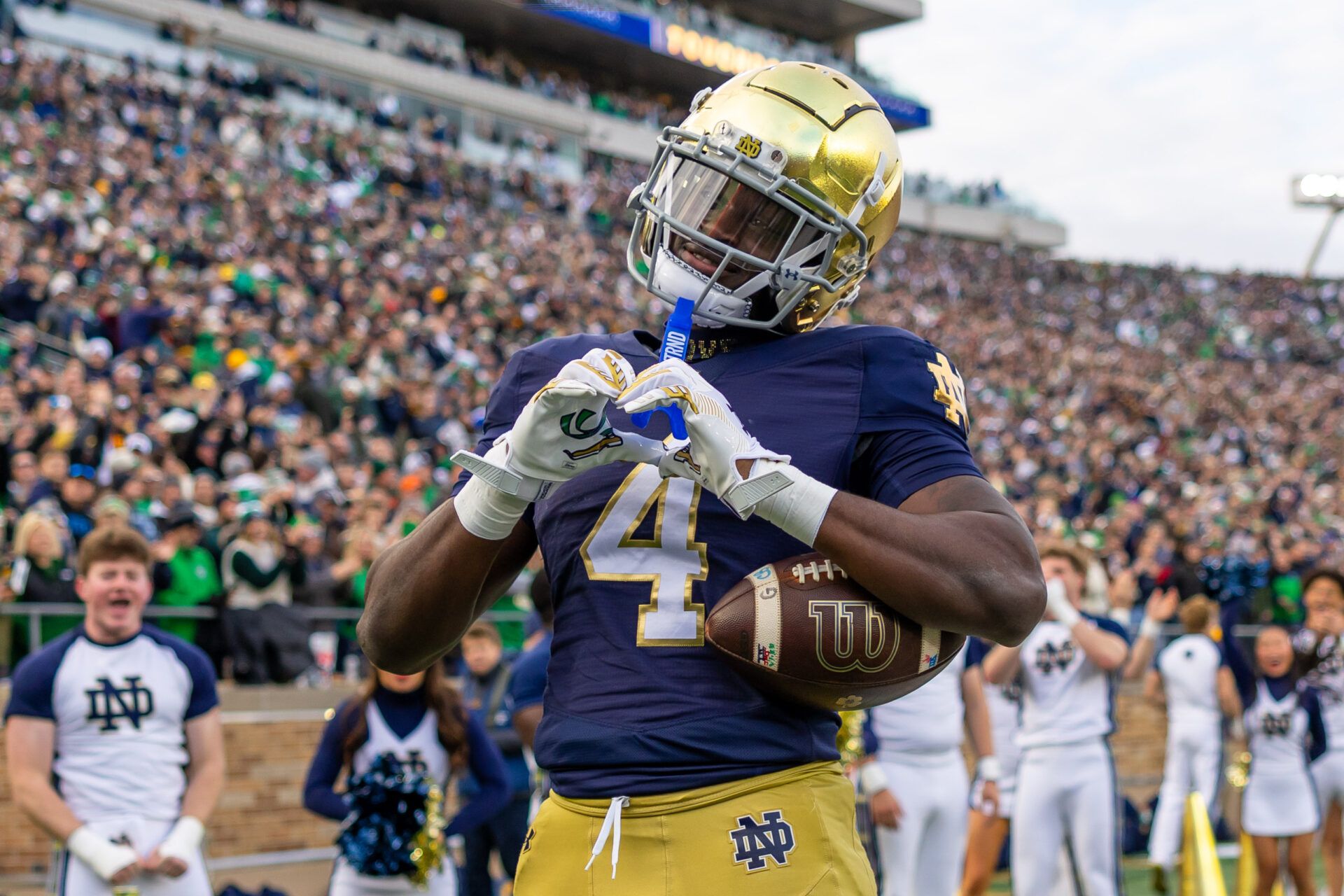 Notre Dame Fighting Irish running back Jeremiyah Love (4) celebrates scoring against the Syracuse Orange during the first half at Notre Dame Stadium.