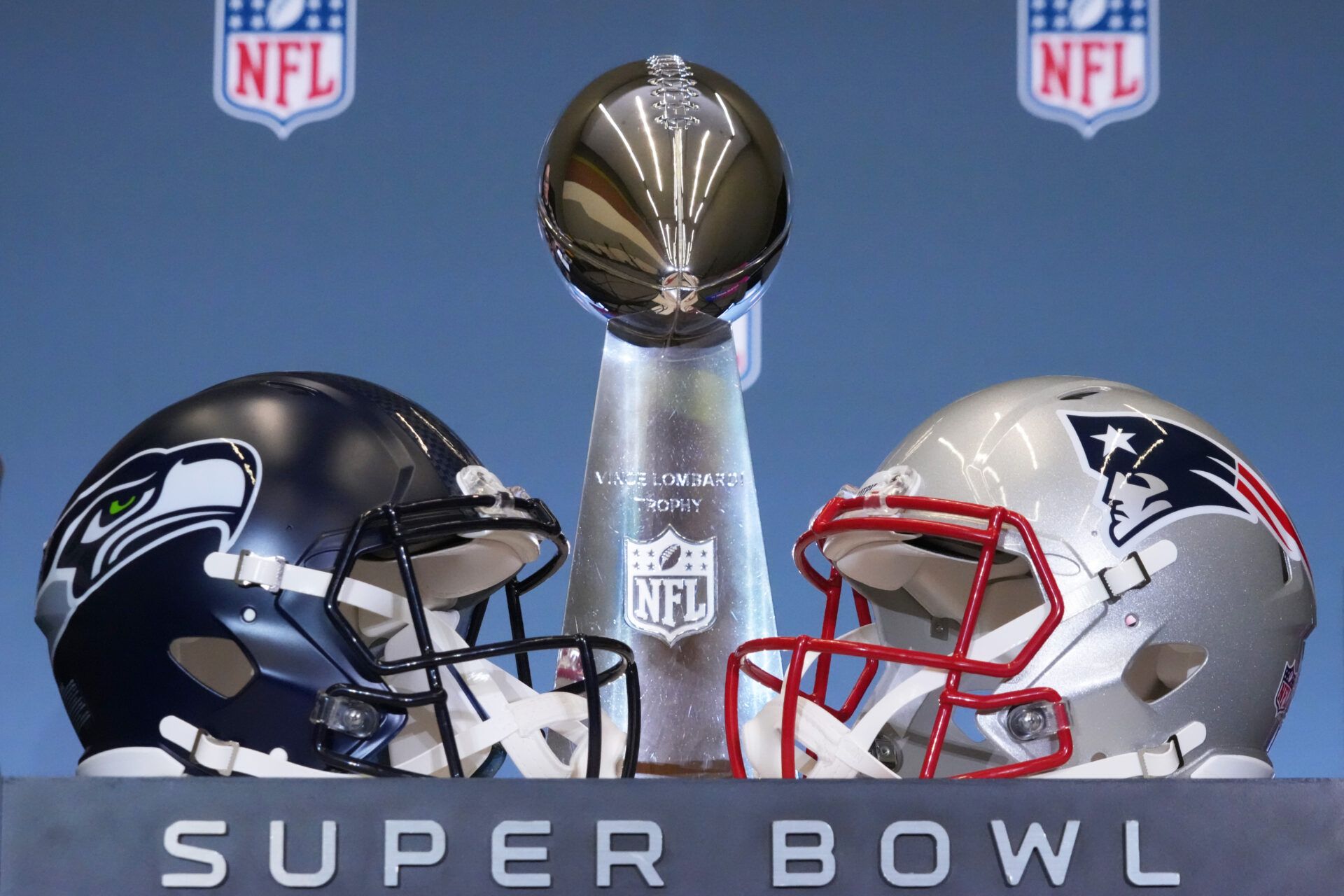 The Seattle Seahawks and New England Patriots helmets are displayed with the Vince Lombardi Trophy before a press conference for NFL commissioner Roger Goodell at San Jose Convention Center.