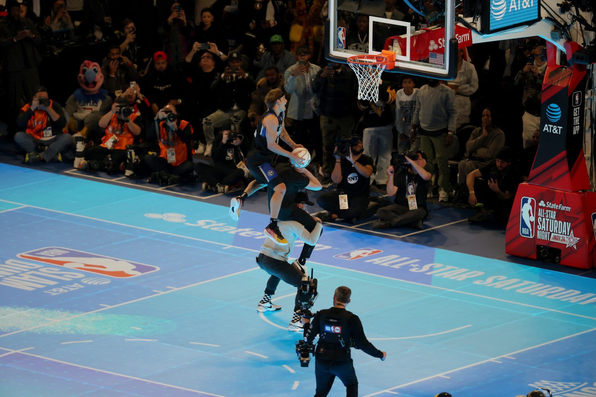 Osceola Magic guard Mac McClung (0) competes in the AT&T Slam Dunk Contest during NBA All Star Saturday Night at Lucas Oil Stadium.