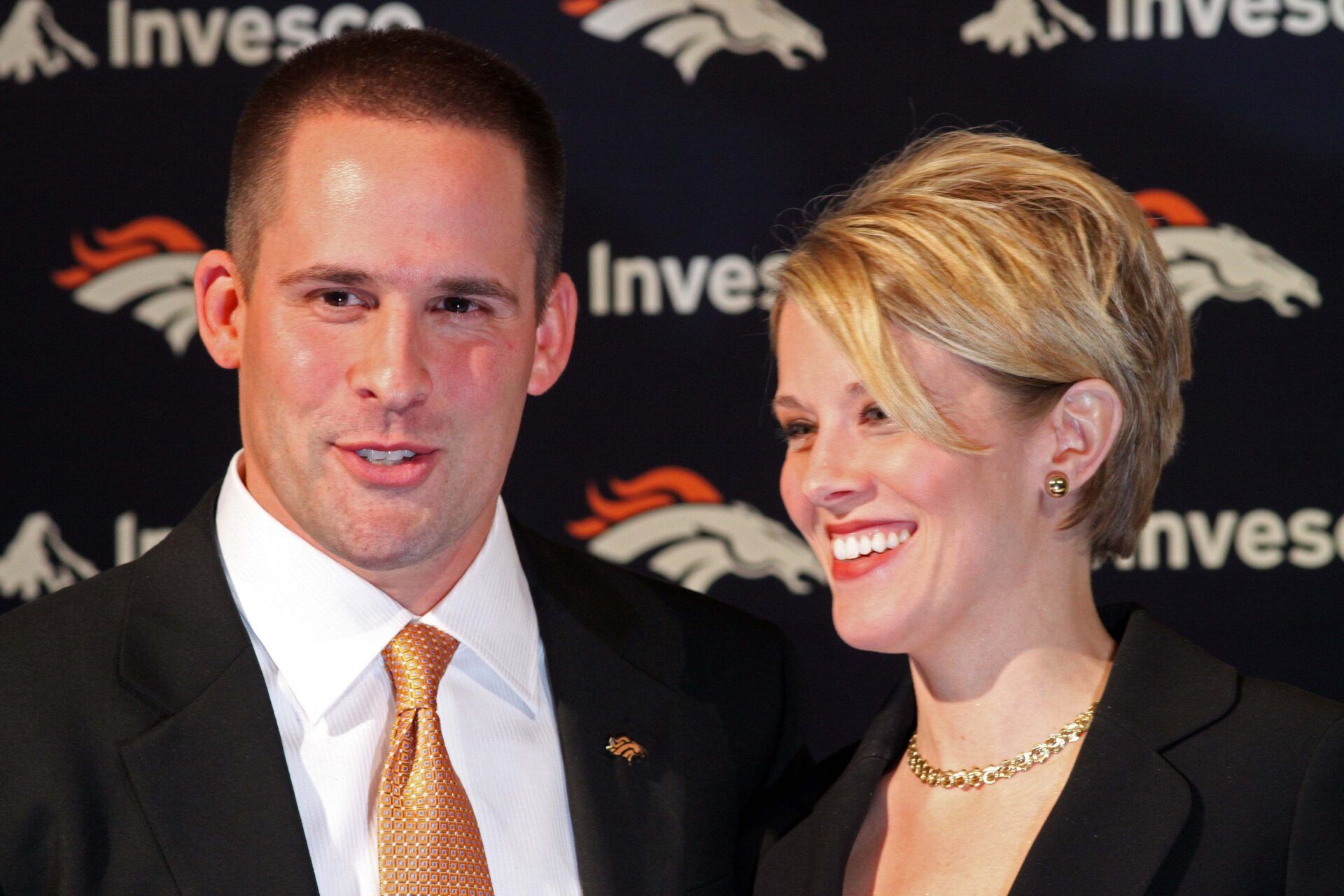 Denver Broncos head coach Josh McDaniels and his wife Laura McDaniels pose for photos after being introduced at a press conference at the Broncos Training Facility.