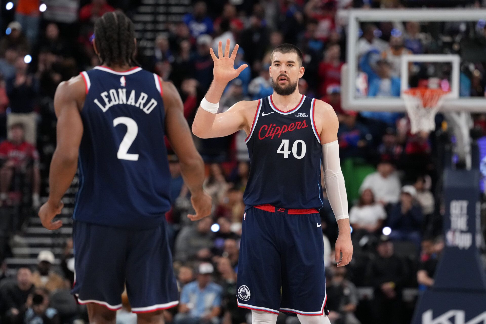 LA Clippers center Ivica Zubac (40) celebrates with forward Kawhi Leonard (2) against the Golden State Warriors in the second half at Intuit Dome.