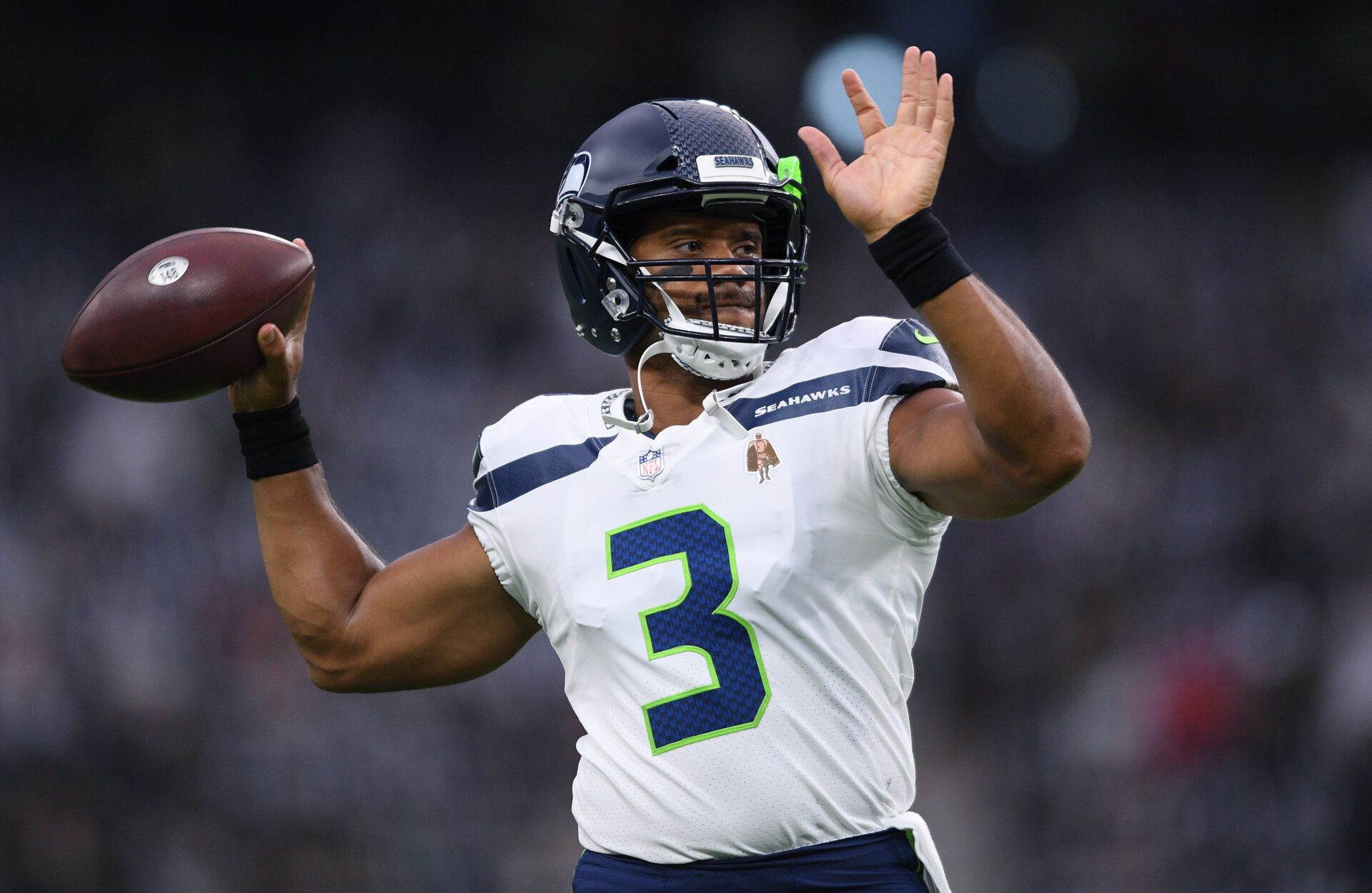 Seattle Seahawks quarterback Russell Wilson (3) throws during warm ups before the game against the Las Vegas Raiders at Allegiant Stadium.