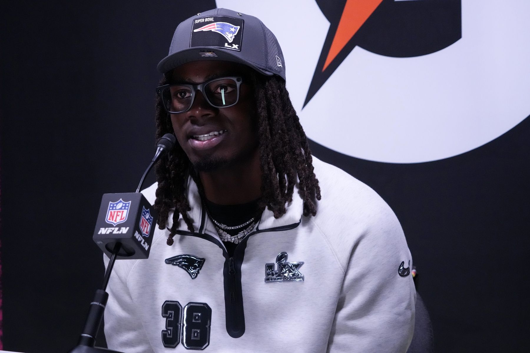 New England Patriots running back Rhamondre Stevenson (38) speaks to the media during Opening Night for Super Bowl LX at San Jose Convention Center.