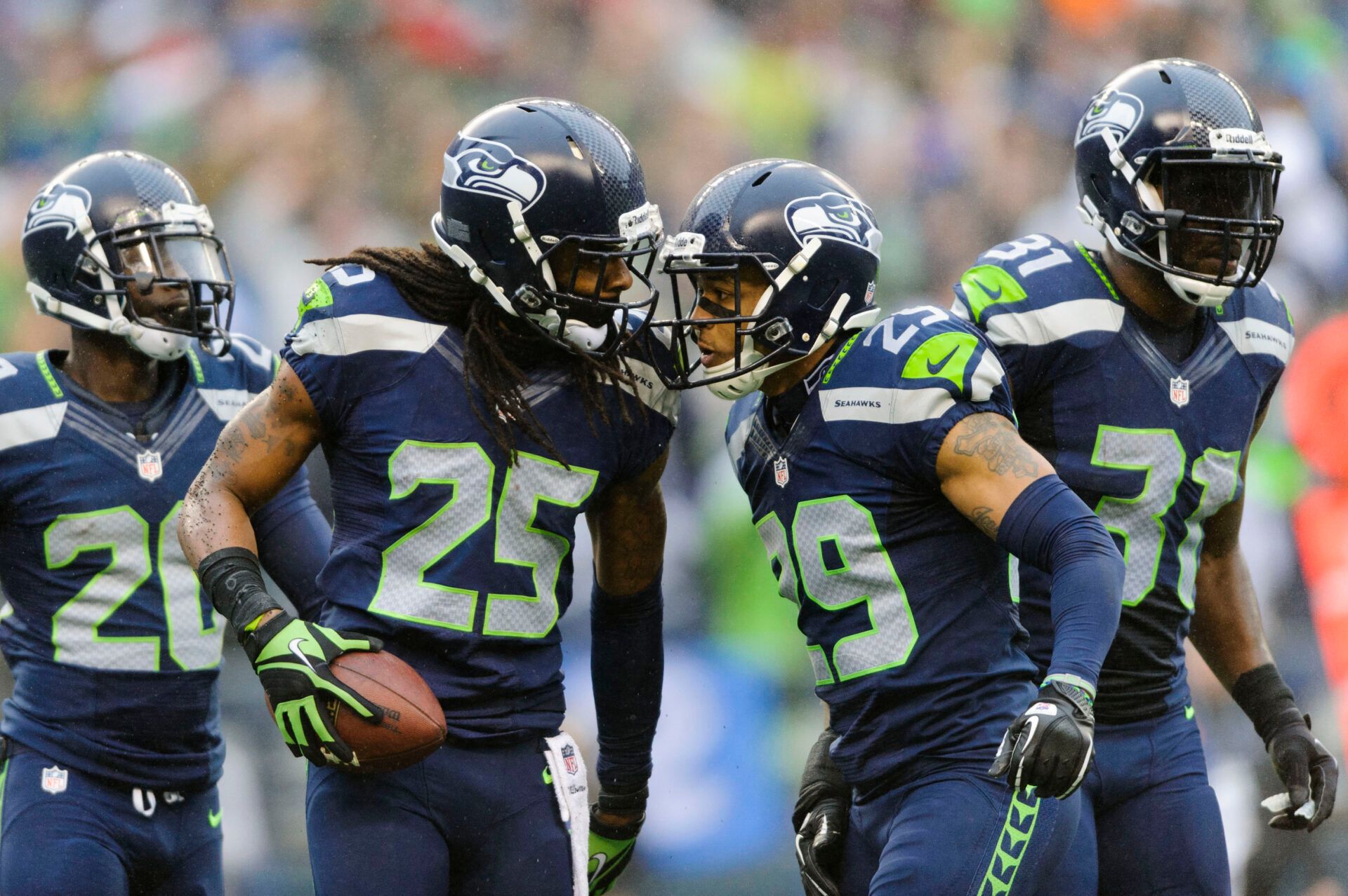 Seattle Seahawks cornerback Richard Sherman (25) and free safety Earl Thomas (29) celebrate after Sherman intercepted the ball thrown by Arizona Cardinals quarterback Carson Palmer (not pictured) during the game at CenturyLink Field. Arizona defeated Seattle 17-10.