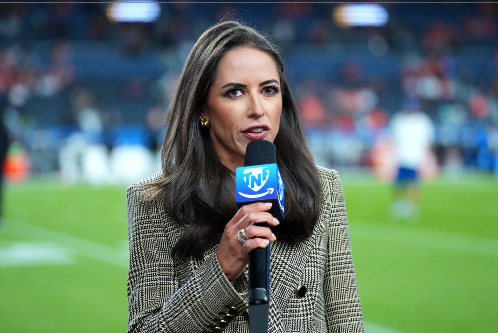 American broadcaster Kaylee Hartung before the game at Empower Field at Mile High.