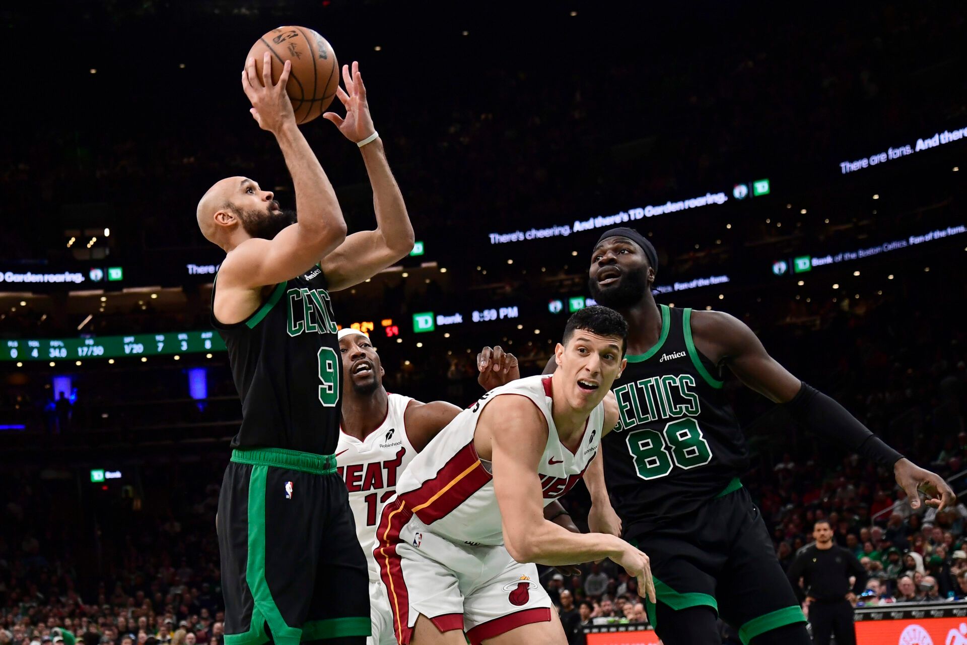 Boston Celtics guard Derrick White (9) shoots the ball during the second half against the Miami Heat at TD Garden.