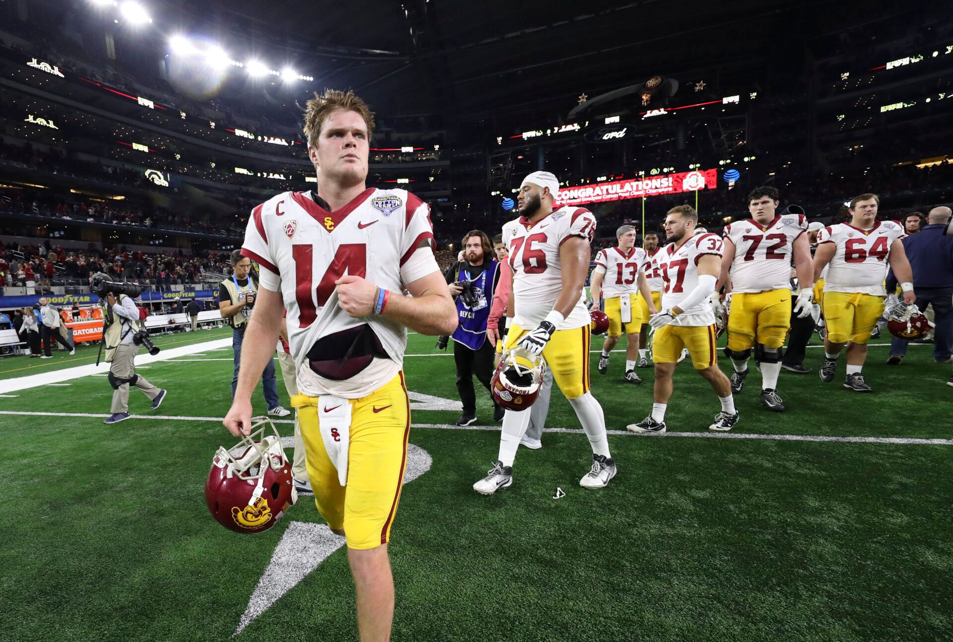 USC Trojans quarterback Sam Darnold (14) walks off the field after the loss to the Ohio State Buckeyes in the 2017 Cotton Bowl at AT&T Stadium.