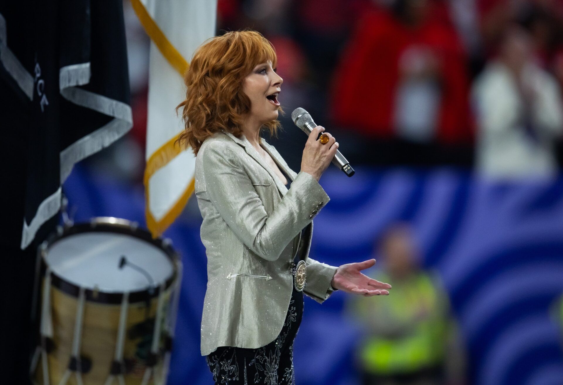 Recording artist Reba McEntire performs the National Anthem before Super Bowl LVIII between the Kansas City Chiefs and the San Francisco 49ers at Allegiant Stadium.
