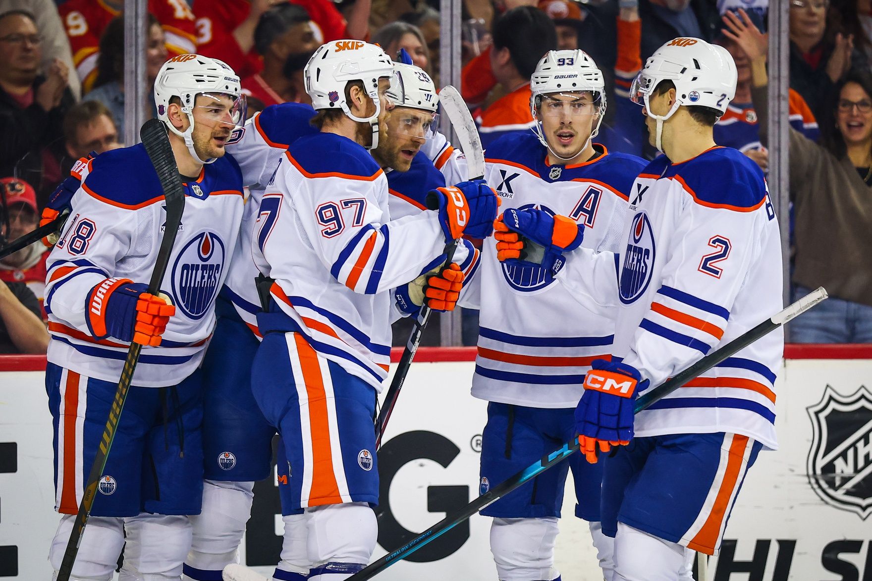 Edmonton Oilers center Leon Draisaitl (29) celebrates his goal with teammates against the Calgary Flames during the first period at Scotiabank Saddledome.