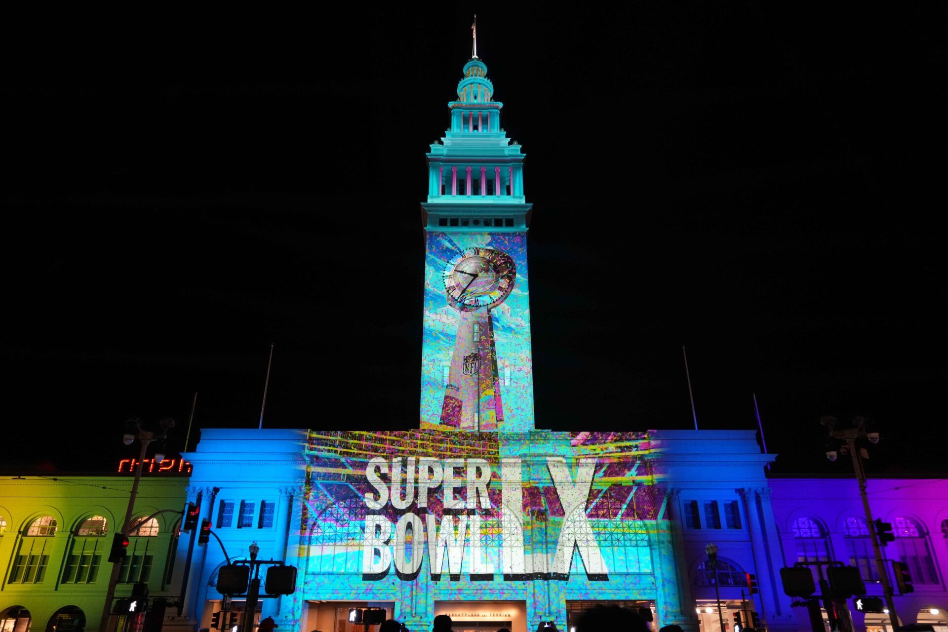 The Super Bowl LX logo is projected on the Ferry Building.