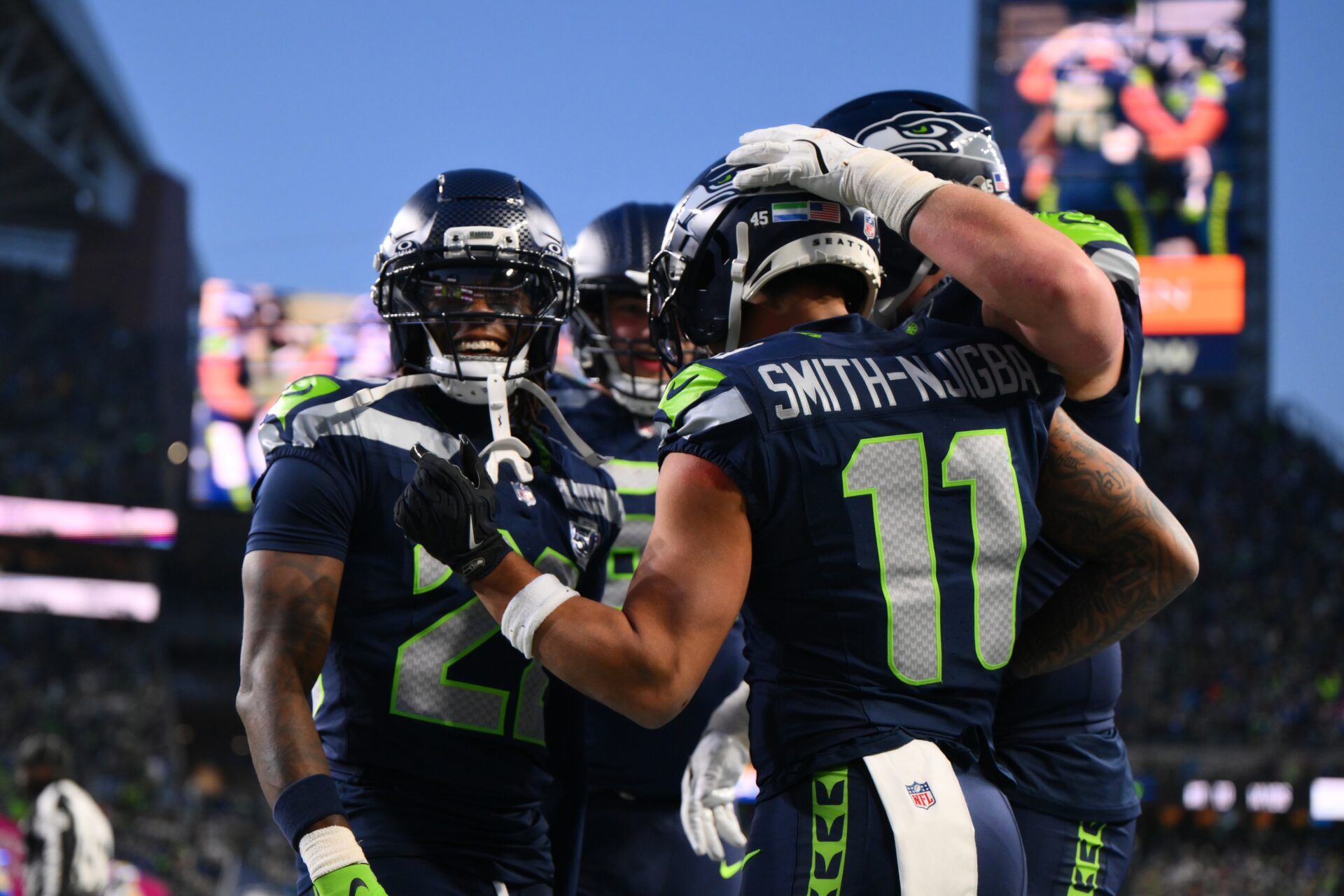 Seattle Seahawks wide receiver Jaxon Smith-Njigba (11) celebrates with teammates after scoring a touchdown against the Los Angeles Rams during the first half in the 2026 NFC Championship Game at Lumen Field.