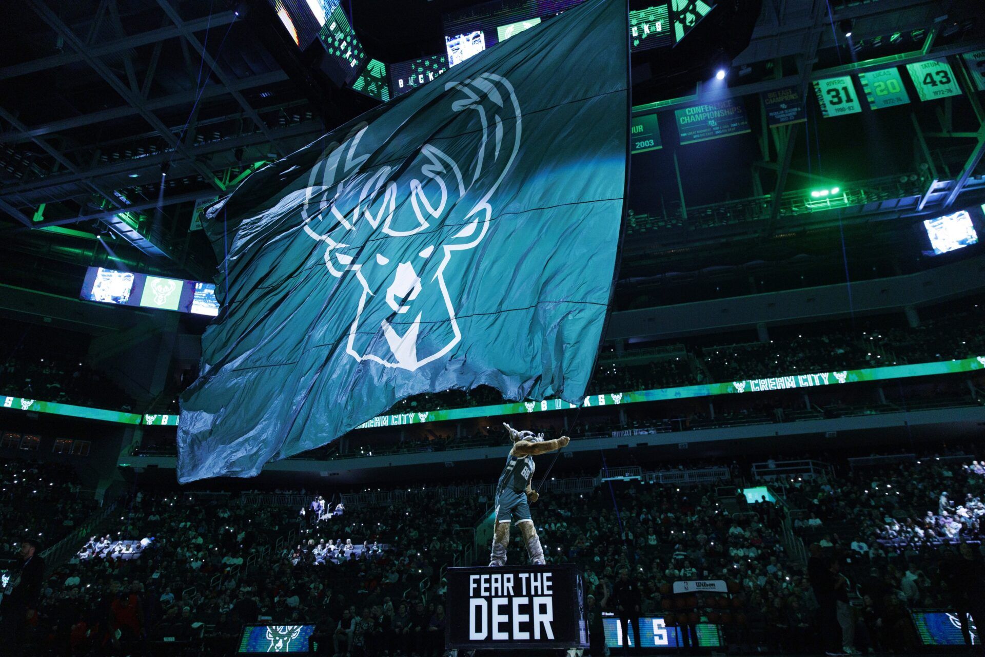 Milwaukee Bucks mascot Bango waves flag with the Milwaukee Bucks logo prior to the game against the Chicago Bulls at Fiserv Forum.