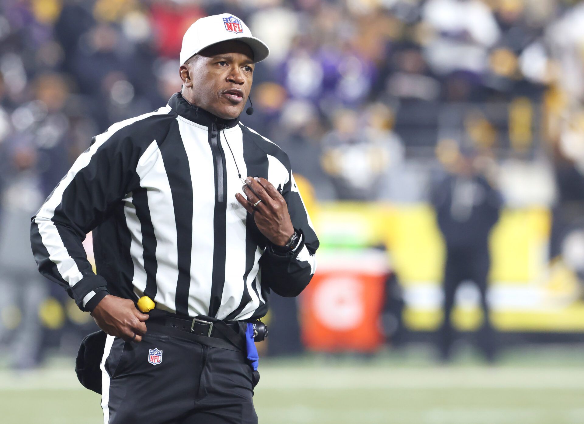 NFL referee Shawn Smith (14) announces a penalty during the second quarter between the Baltimore Ravens and the Pittsburgh Steelers at Acrisure Stadium.