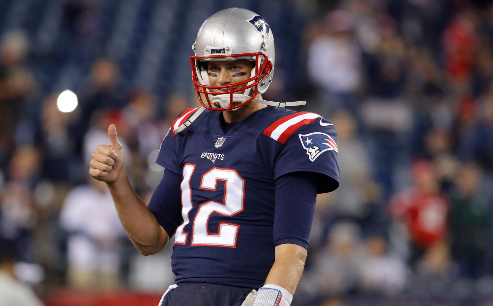 New England Patriots quarterback Tom Brady (12) warms up before the start of the game against the Atlanta Falcons at Gillette Stadium.