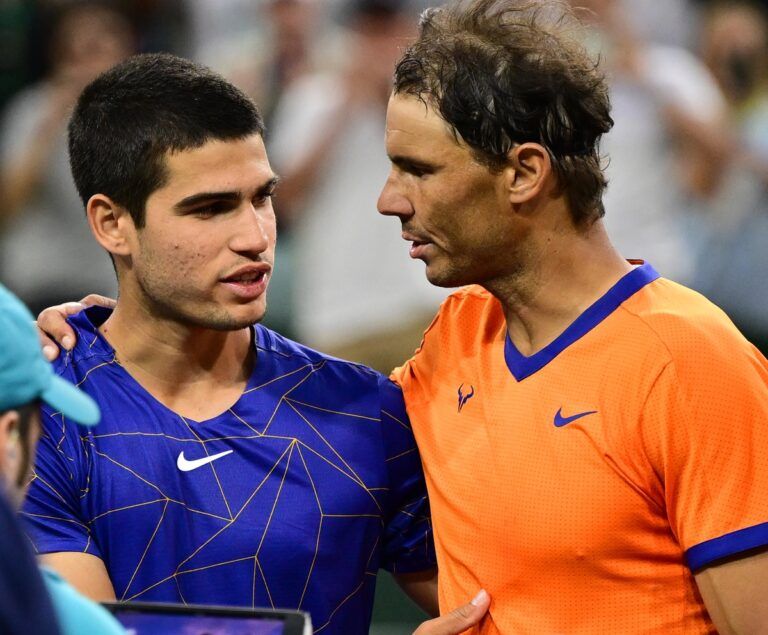 Rafael Nadal (ESP) gripping shakes hands Carlos Alcaraz (ESP) after their semifinal match at the BNP Paribas Open at the Indian Wells Tennis Garden.
