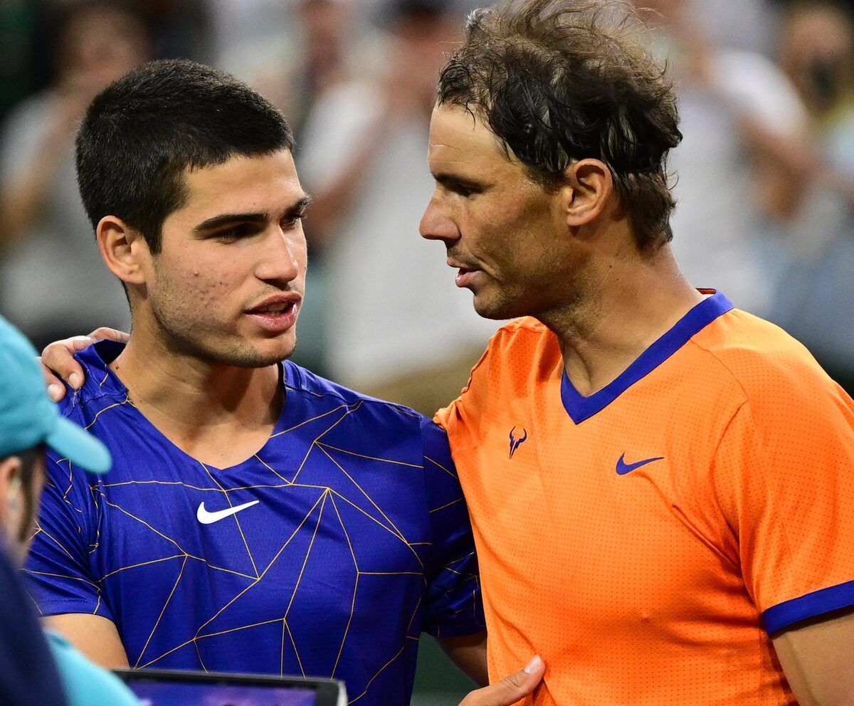 Rafael Nadal (ESP) gripping shakes hands Carlos Alcaraz (ESP) after their semifinal match at the BNP Paribas Open at the Indian Wells Tennis Garden.