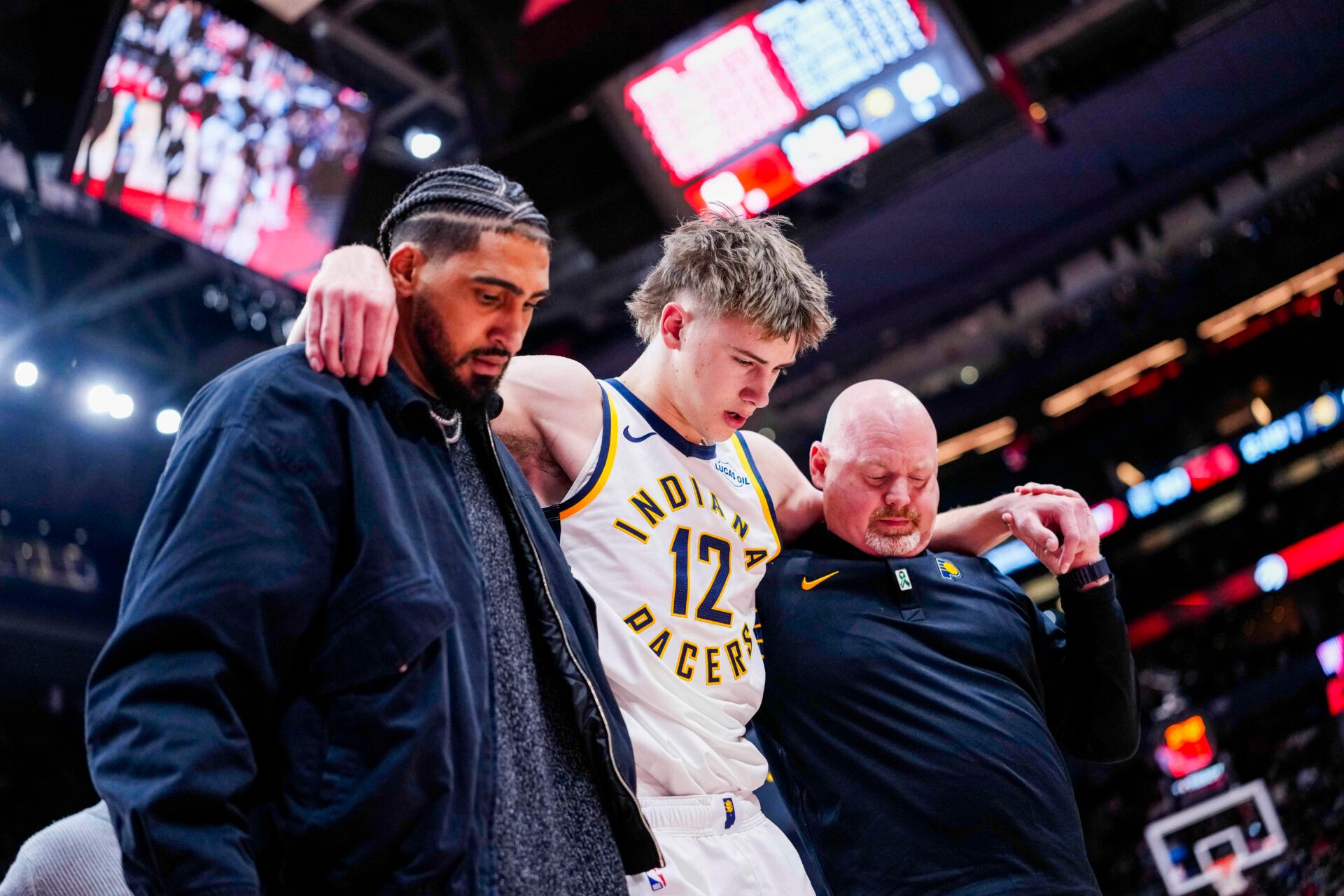 Indiana Pacers guard Johnny Furphy (12) leaves the game after injuring himself during the second half against the Toronto Raptors at Scotiabank Arena.