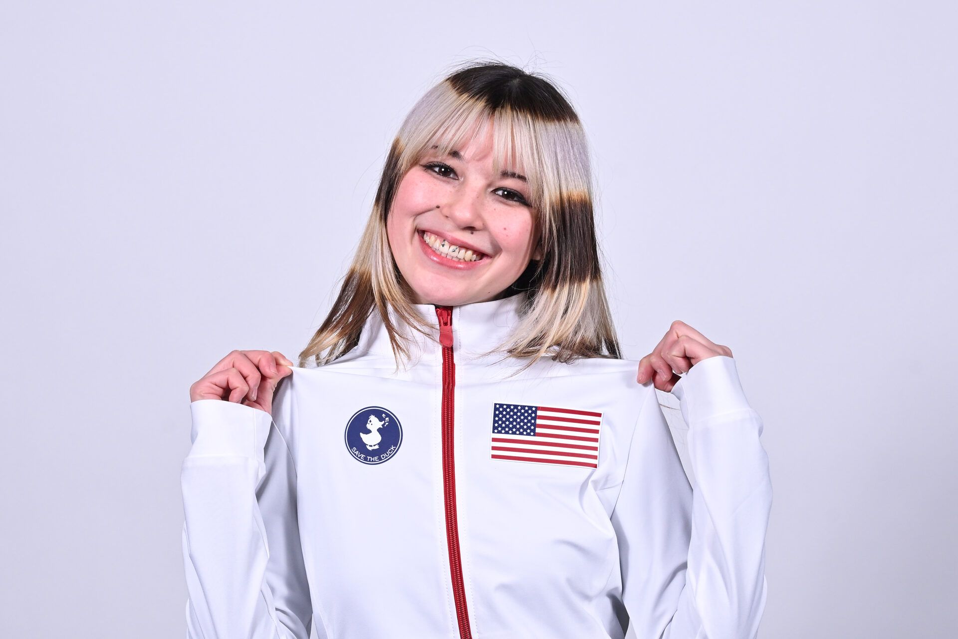 Alysa Liu poses for a photo following the 2026 Milan Olympics figure skating team announcement show at Enterprise Center.