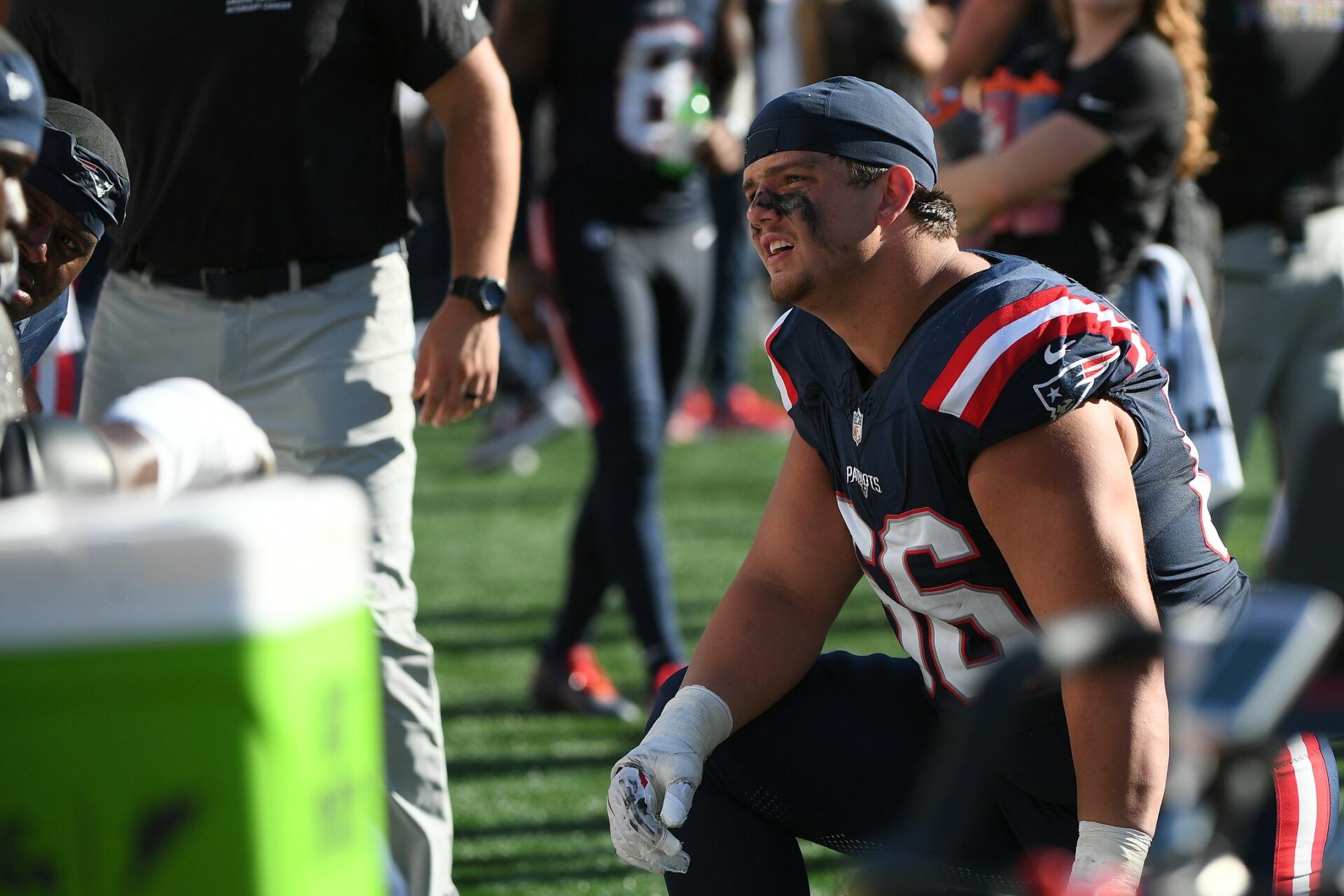 New England Patriots offensive tackle Will Campbell (66) talks to a teammate during the second half against the Carolina Panthers at Gillette Stadium.