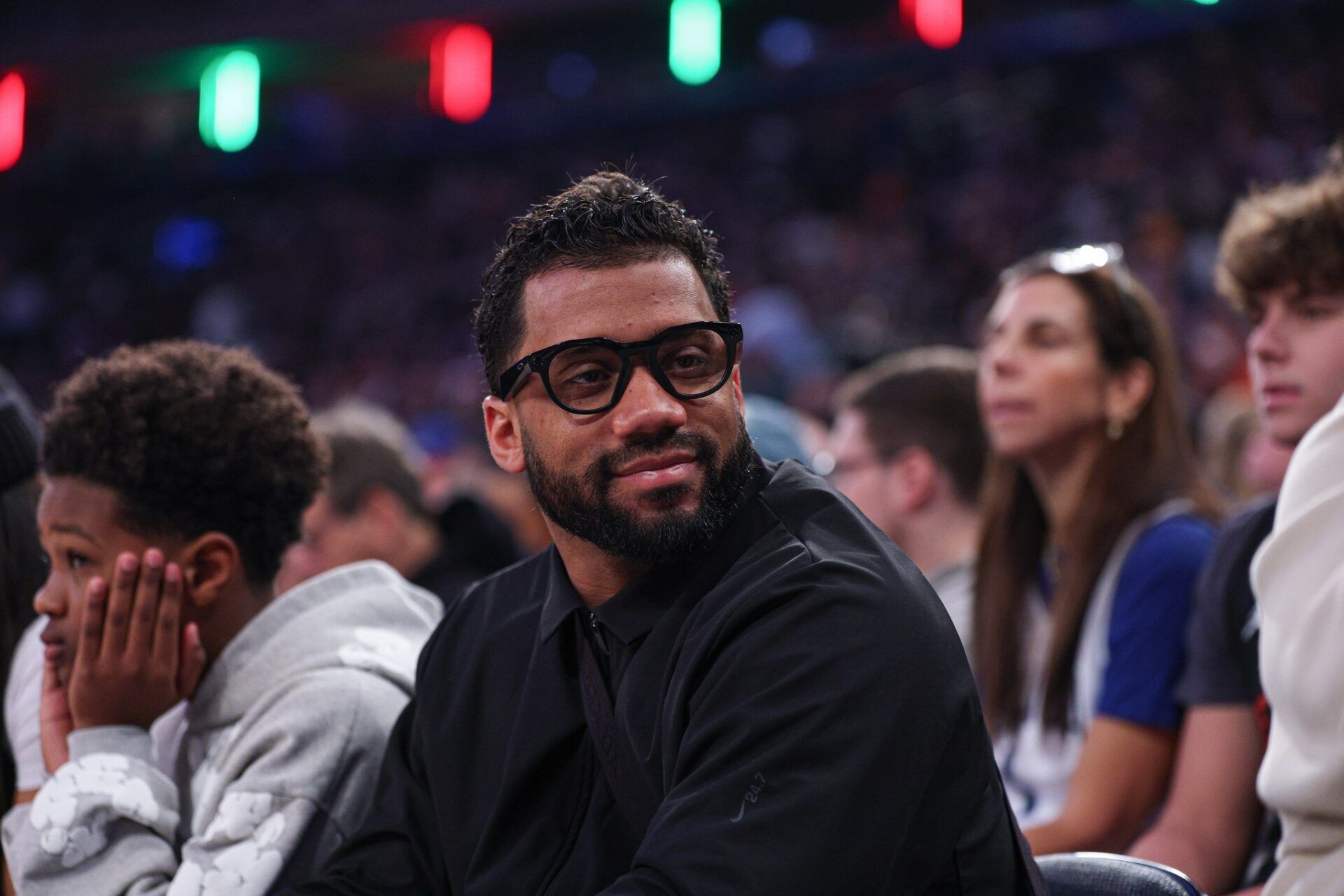 New York Giants quarterback, Russell Wilson, sits court-side during the first quarter of the NBA game between the New York Knicks and the Cleveland Cavaliers at Madison Square Garden.